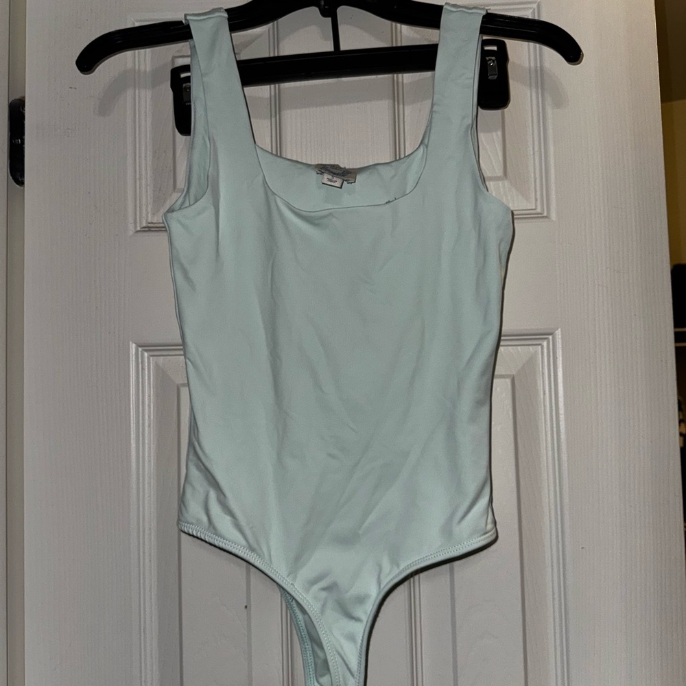 Women’s light blue bodysuit
